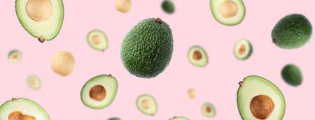 Seamless pattern with avocado. Tropical abstract background. Avocado on pink background.の写真素材