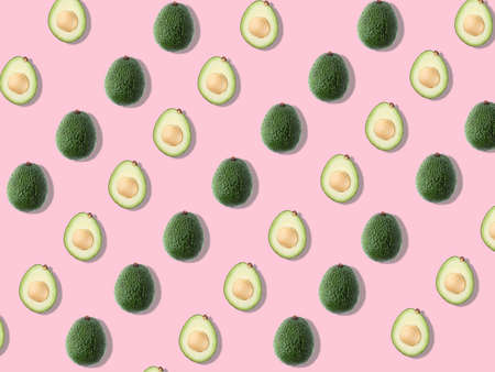 Seamless pattern with avocado. Tropical abstract background. Avocado on pink background.の写真素材