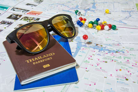 Thailand Passport and sunglasses on map 1の写真素材