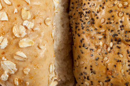 Close up shot of two fresh wholegrain seeded bread rolls side by sideの写真素材