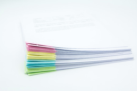 stack of business papers isolated with whiteの写真素材