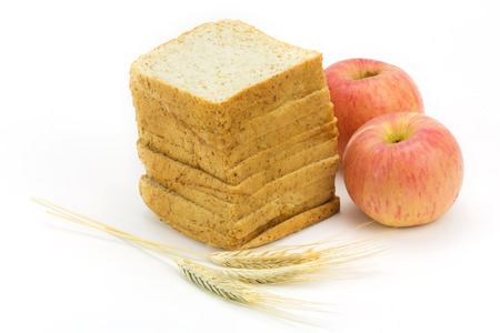 bread and apple isolated on white background,focus on breadの写真素材