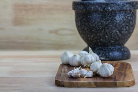 Garlic on the wooden backgroundの写真素材