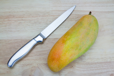 Mango on a wooden backgroundの写真素材