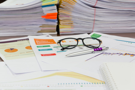 Analysis chart and paperwork on office table