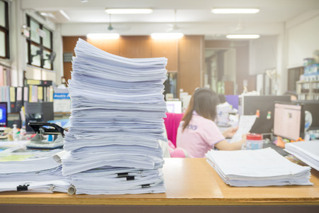 Pile of unfinished documents on office desk, Stack of businesspaper