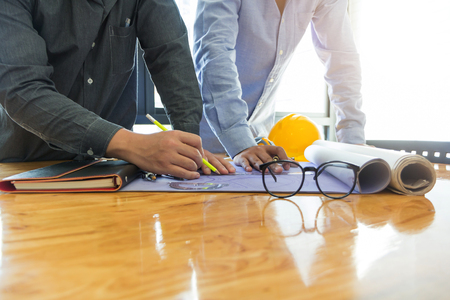 Architect concept, Architects working with blueprints in the officeの写真素材