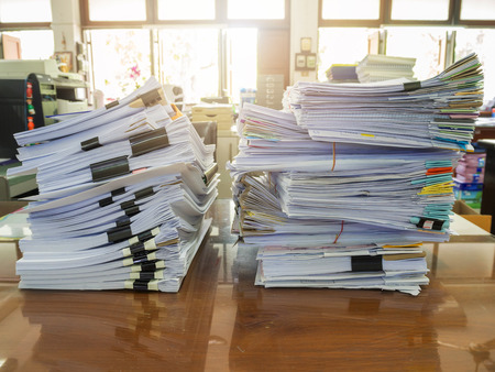 Business Concept, Pile of unfinished business documents on office desk, Stack of business paper