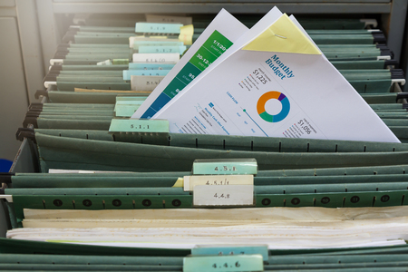 New report file in old filing cabinetの写真素材