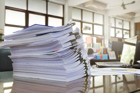 Business Concept, Pile of unfinished documents on office desk, Stack of business paperの写真素材