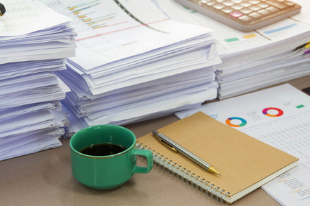 Business Concept, Pile of unfinished documents on office desk, Stack of business paper
