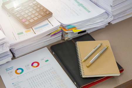 Business Concept, Pile of unfinished documents on office desk, Stack of business paperの写真素材
