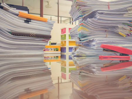 Business Concept, Pile of unfinished documents on office desk, Stack of business paper, Vintage Effectの写真素材