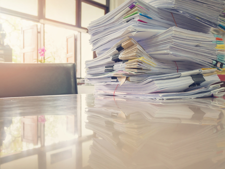Business Concept, Pile of unfinished documents on office desk, Stack of business paper, Vintage...