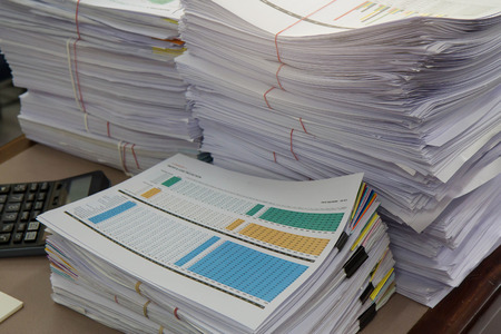 Business Concept, Pile of unfinished documents on office desk, Stack of business paper