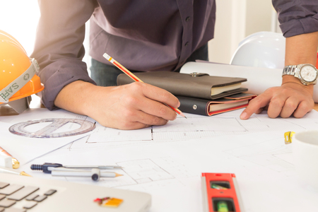 Architect concept, Architects working with blueprints in the officeの写真素材