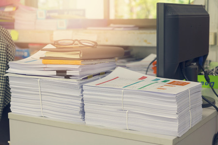 Pile of unfinished documents on office desk, Stack of business paper