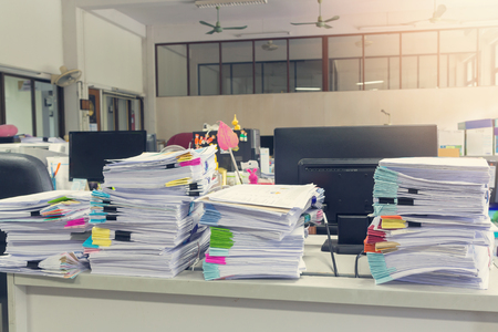 Pile of unfinished documents on office desk, Stack of business paper