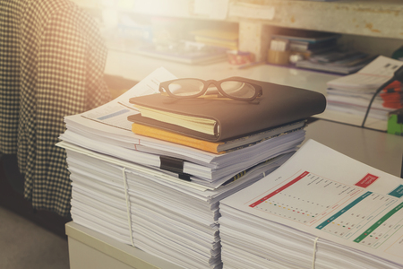 Pile of unfinished documents on office desk, Stack of business paper, Vintage Effectの写真素材