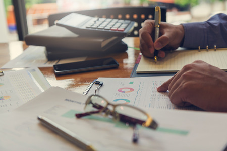 Business and finance concept of office working, Businessman working with analysis chart, Vintage effectの写真素材