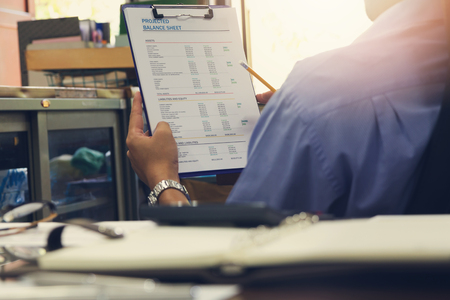 Business and finance concept of office working, Businessmen discussing analysis account balance chart, Vintage effectの写真素材