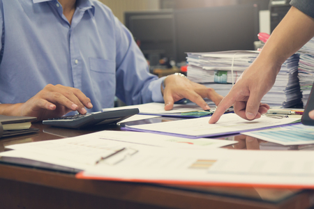 Business and finance concept of office working,Teamwork of Businessmen discussing analysis Chartの写真素材