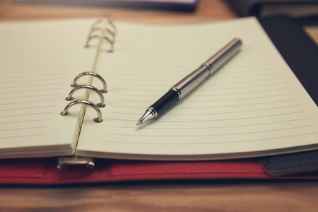 Business and finance concept of office working, Closeup pen on office desk in working day.の写真素材