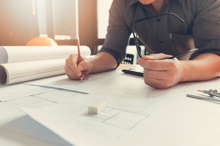 Engineer and Architect concept, Engineer Architects office team working with blueprints, Vintage Effectの写真素材