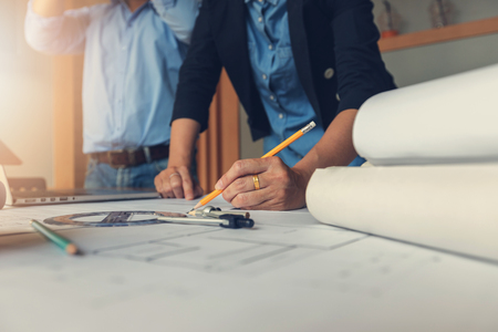 Engineer and Architect concept, Engineer Architects office team working with blueprints, Vintage Effectの写真素材