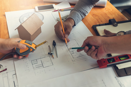 Engineer and Architect concept, Engineer Architects office team working with blueprints