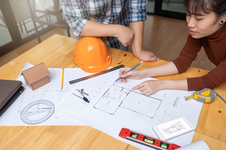 Engineer and Architect concept, Engineer Architects office team working with blueprintsの写真素材