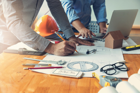 Engineer and Architect concept, Engineer Architects office team working with blueprintsの写真素材