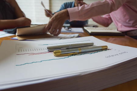 Business and finance concept of office working,Teamwork of Businessmen discussing business plan in officeの写真素材