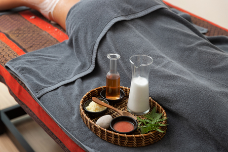 Close up Spa salt scrub and massage therapy oil.の写真素材