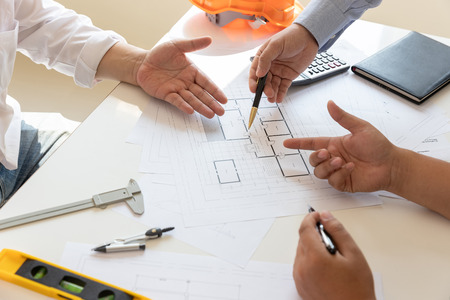 Engineer and Architect concept, Engineer Architects office team working with blueprints