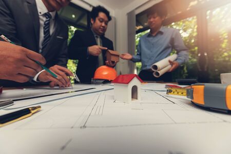 Engineer and Architect concept, Engineer Architects and Real estate agent office team working with...