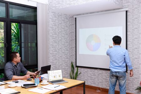 Small and Medium Enterprise Business concept of ,Businessman presenting investment plan to his partner in office.の写真素材
