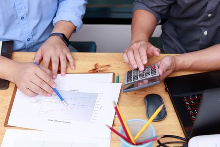 Small and Medium Enterprise Business concept of, Businessman using calculator to calculate Assets Chartの写真素材