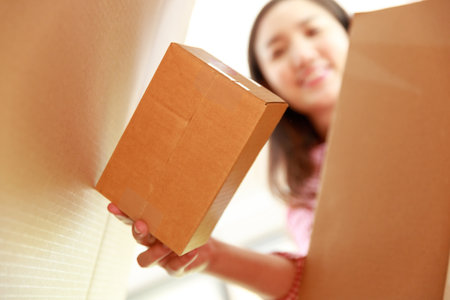 Seller prepare to send goods to customer after checking order.の写真素材