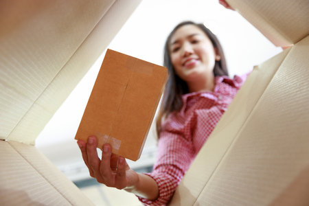 Seller prepare to send goods to customer after checking order.の写真素材