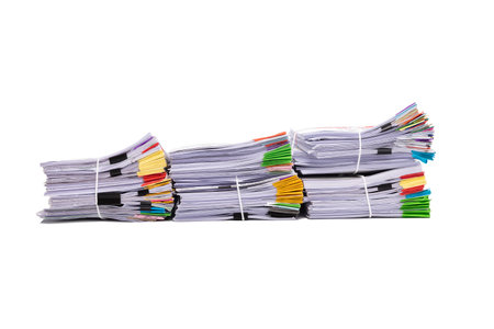Stack of business documents papers isolated on white backgroundの写真素材