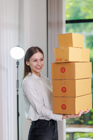 Concept of parcel delivery and selling online,Retailer holding parcel box prepare to send the...