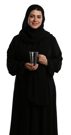Portrait of muslim woman with glass of water on white backgroundの写真素材