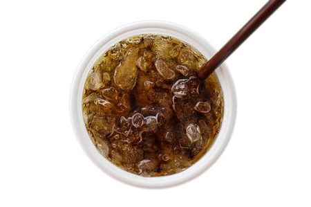 Isolated white plastic cup contained ice and cola on white background