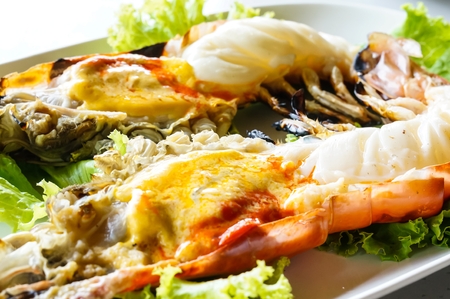 Grilled big shrimp served with fresh lettuceの写真素材