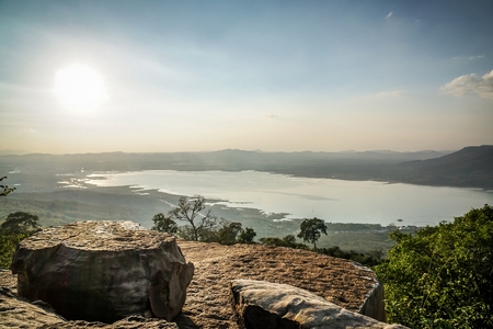 On a big cliff with sunlight in Thailandの写真素材