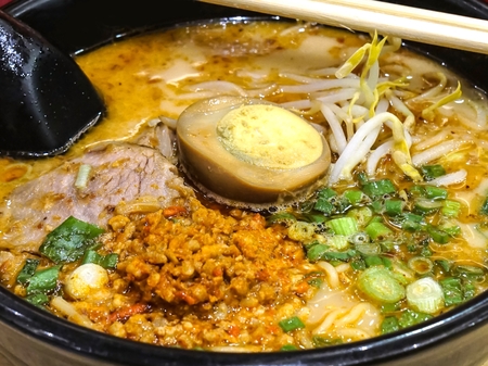 Ramen noodle served with boiled egg on topの写真素材