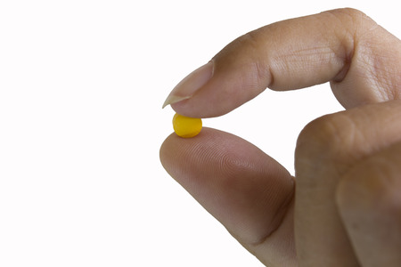 Handful of pills on white backgroundの写真素材