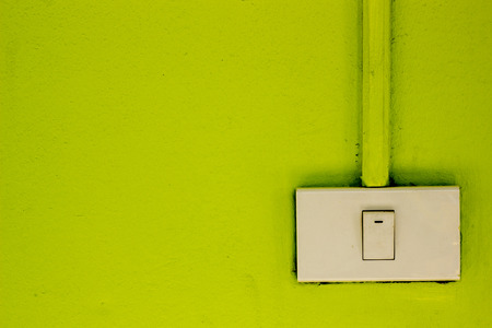 Light switches on the green wall