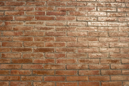 Old brick wall. Horizontal wide brick wall background. Vintage house facade.の写真素材